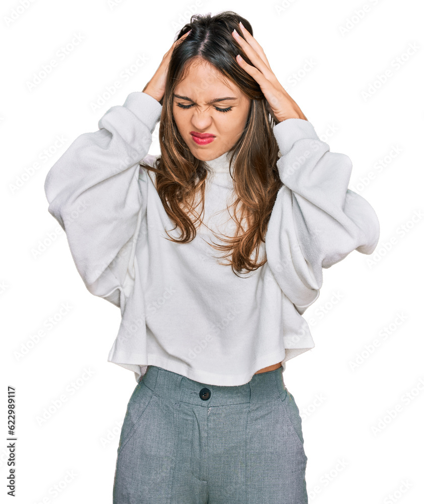 Young brunette woman wearing casual turtleneck sweater suffering from headache desperate and stressed because pain and migraine. hands on head. Young brunette woman wearing casual turtleneck sweater suffering from headache desperate and stressed because pain and migraine. hands on head.