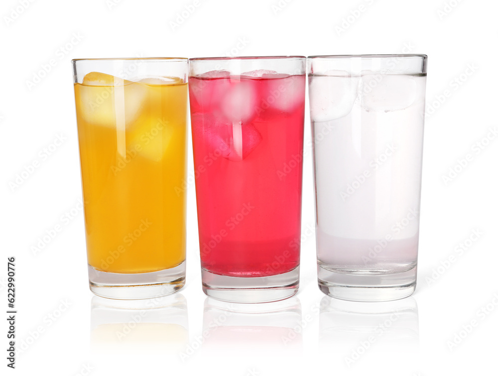 Glasses of different refreshing soda water with ice cubes on white background Glasses of different refreshing soda water with ice cubes on white background