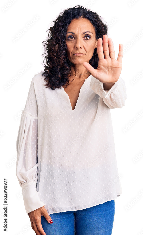 Middle age beautiful woman wearing casual sweater doing stop sing with palm of the hand. warning expression with negative and serious gesture on the face. Middle age beautiful woman wearing casual sweater doing stop sing with palm of the hand. warning expression with negative and serious gesture on the face.