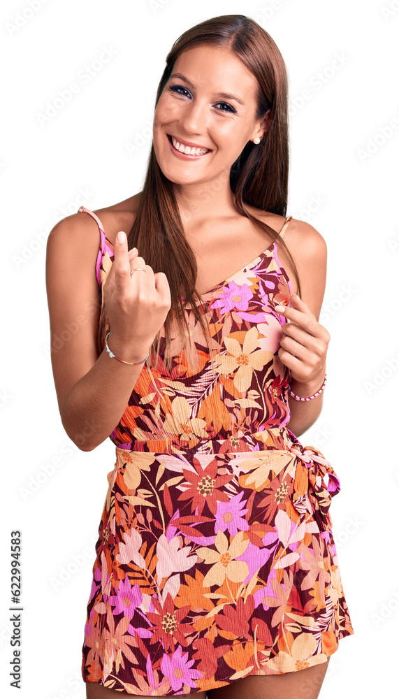Young beautiful hispanic woman wearing casual clothes beckoning come here gesture with hand inviting welcoming happy and smiling Young beautiful hispanic woman wearing casual clothes beckoning come here gesture with hand inviting welcoming happy and smiling