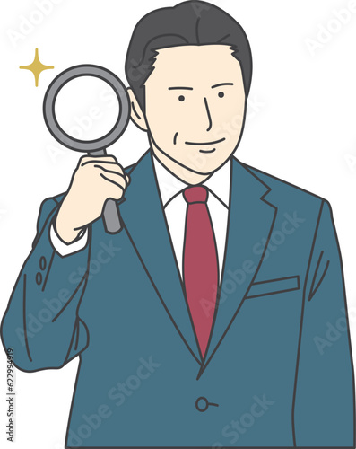 A man in a suit with a magnifying glass