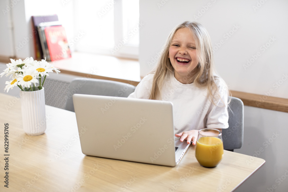Smiling little girl having video call in remote class with teacher using laptop, happy little kid greeting with tutor, learning online on computer, home learning concept
Smiling little girl having video call in remote class with teacher using laptop, happy little kid greeting with tutor, learning online on computer, home learning concept