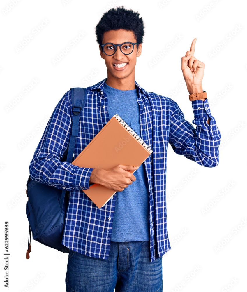 Young african american man wearing student backpack holding book pointing finger up with successful idea. exited and happy. number one. Young african american man wearing student backpack holding book pointing finger up with successful idea. exited and happy. number one.