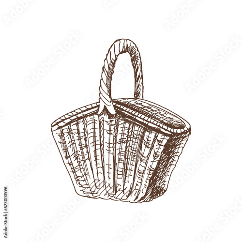 Hand drawn vector sketch of a wicker picnic basket. Doodle vintage illustration. Engraved immage.