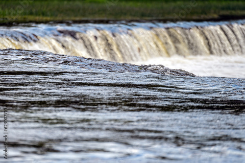 Water splashing through widest rockwaterfall in Europe - Ventas rumba. photo