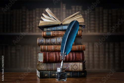 Old books ,quill pen and vintage inkwell on wooden desk in old library. Ancient books historical background. Retro style. Conceptual background on history, education, literature topics..