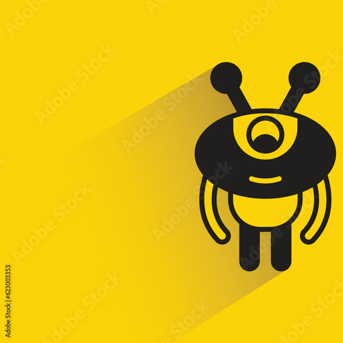 cute robot with shadow on yellow background