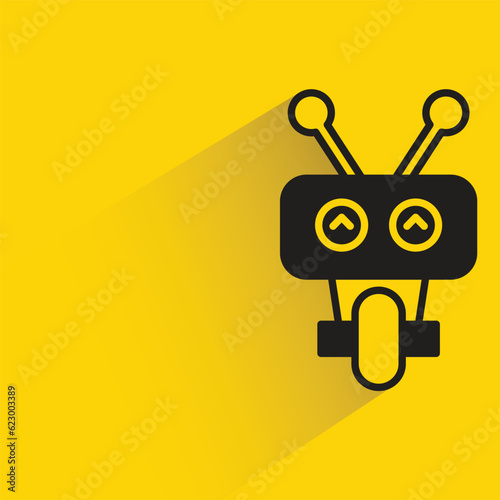 cute robot with shadow on yellow background