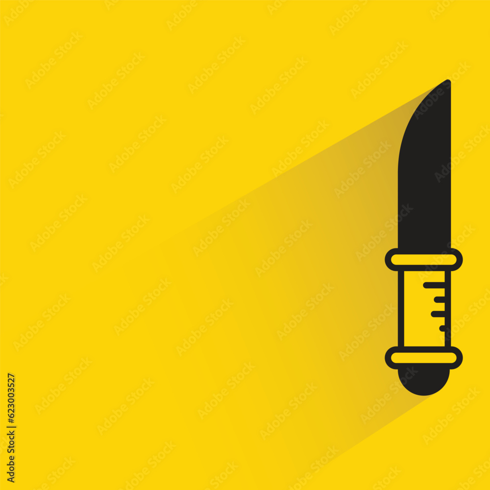 knife with shadow on yellow background knife with shadow on yellow background