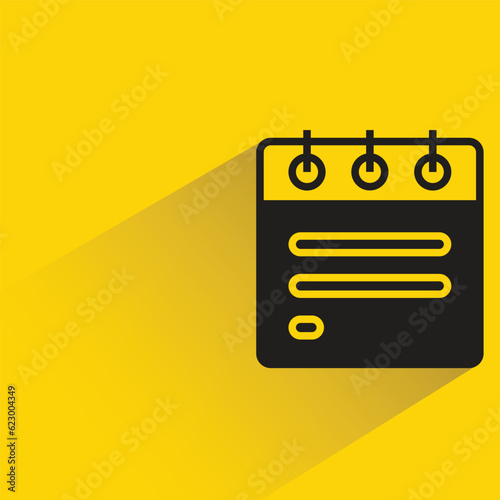 calendar with shadow on yellow background