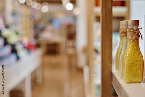 Close-up of bottles with bath salt standing on shelf in a row in the store