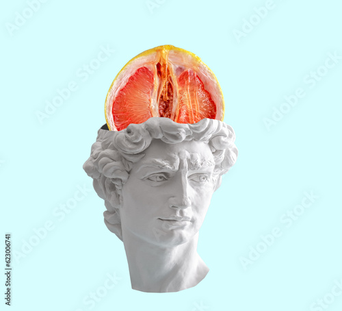 Creative collage of David's head with grapefruit on a blue background. Sex concept.