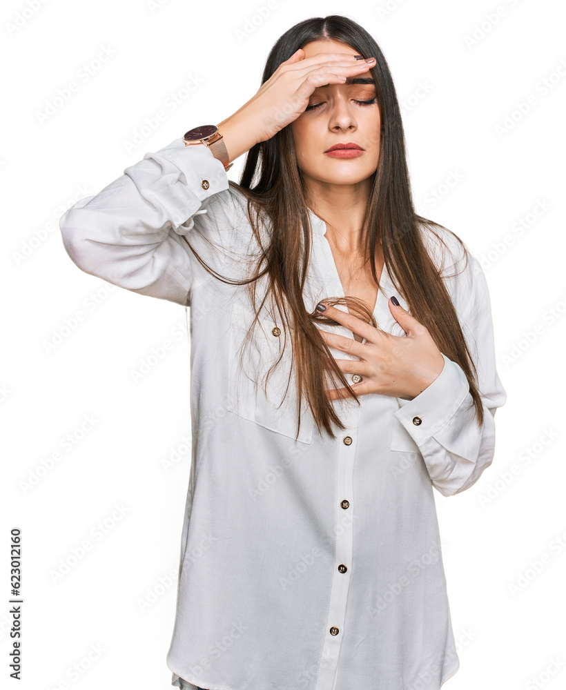 Young beautiful woman wearing casual white shirt touching forehead for illness and fever, flu and cold, virus sick Young beautiful woman wearing casual white shirt touching forehead for illness and fever, flu and cold, virus sick