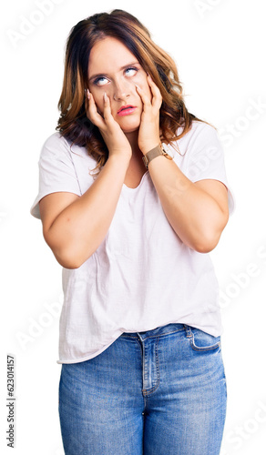 Young beautiful caucasian woman wearing casual white tshirt tired hands covering face, depression and sadness, upset and irritated for problem