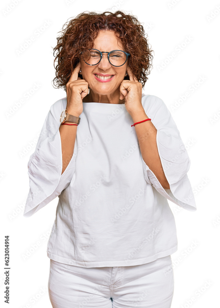 Beautiful middle age mature woman wearing casual clothes and glasses covering ears with fingers with annoyed expression for the noise of loud music. deaf concept. Beautiful middle age mature woman wearing casual clothes and glasses covering ears with fingers with annoyed expression for the noise of loud music. deaf concept.