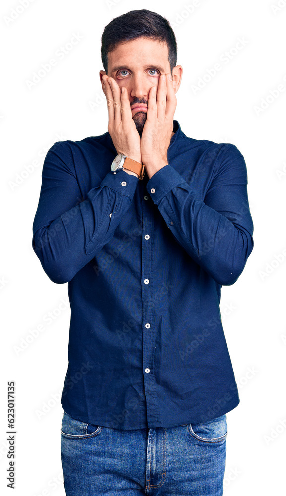 Young handsome man wearing casual shirt tired hands covering face, depression and sadness, upset and irritated for problem Young handsome man wearing casual shirt tired hands covering face, depression and sadness, upset and irritated for problem