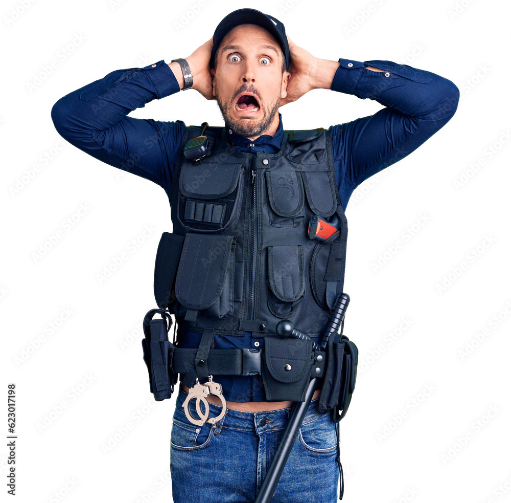 Young handsome man wearing police uniform crazy and scared with hands on head, afraid and surprised of shock with open mouth Young handsome man wearing police uniform crazy and scared with hands on head, afraid and surprised of shock with open mouth