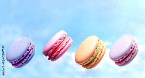 Colored macaroons flying in the air against the blue sky. Advertising suitable for website, banner design. Generative Ai content