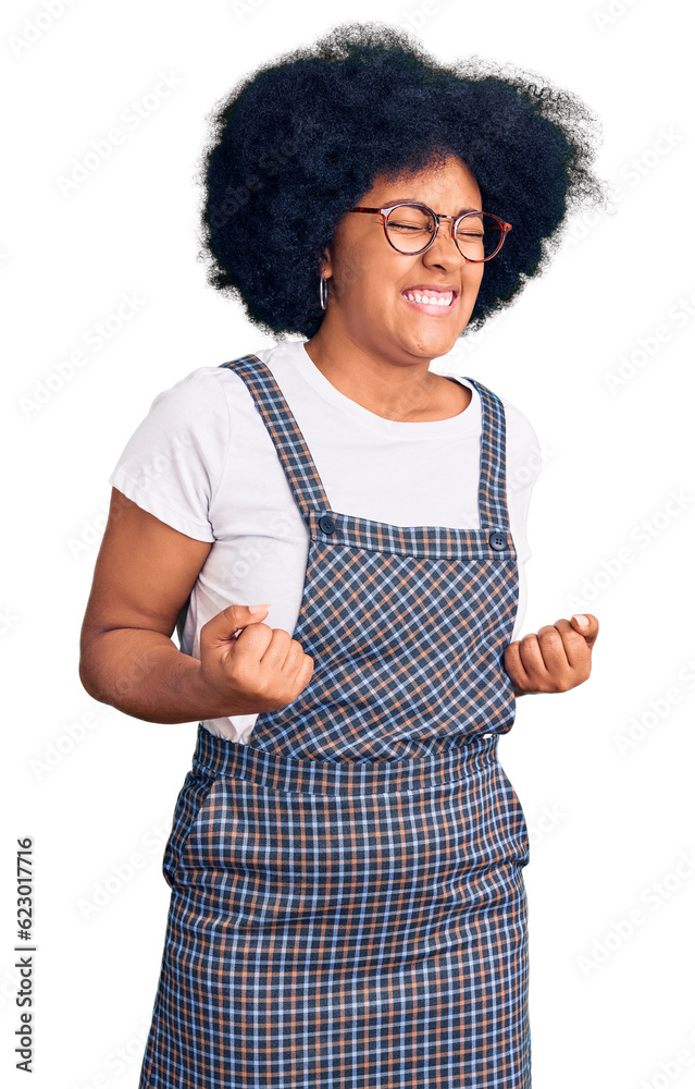 Young african american girl wearing casual clothes excited for success with arms raised and eyes closed celebrating victory smiling. winner concept. Young african american girl wearing casual clothes excited for success with arms raised and eyes closed celebrating victory smiling. winner concept.