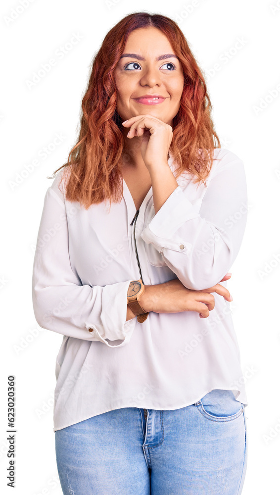 Young latin woman wearing casual clothes with hand on chin thinking about question, pensive expression. smiling with thoughtful face. doubt concept. Young latin woman wearing casual clothes with hand on chin thinking about question, pensive expression. smiling with thoughtful face. doubt concept.