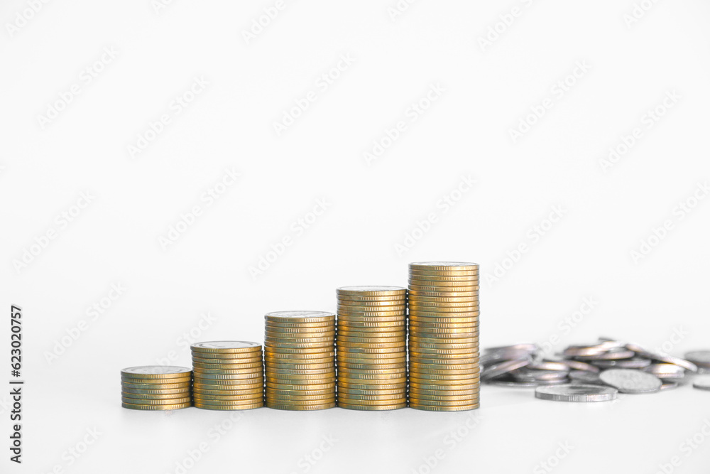Stacks of golden money coin on wooden desk and white background with copy space. Minimal style business background concept. Stacks of golden money coin on wooden desk and white background with copy space. Minimal style business background concept.