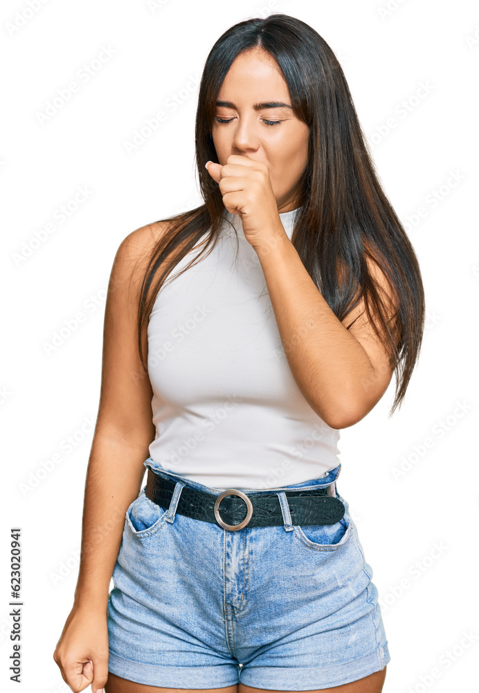 Young beautiful hispanic girl wearing casual clothes feeling unwell and coughing as symptom for cold or bronchitis. health care concept.