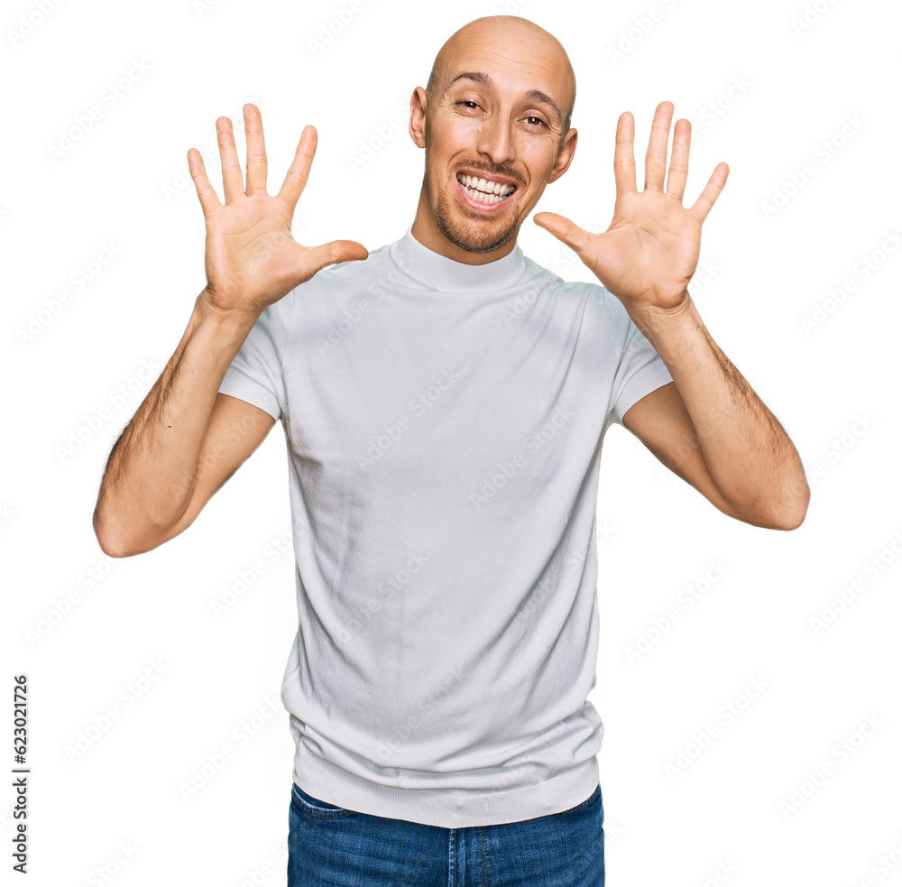 Bald man with beard wearing casual white t shirt showing and pointing up with fingers number ten while smiling confident and happy. Bald man with beard wearing casual white t shirt showing and pointing up with fingers number ten while smiling confident and happy.