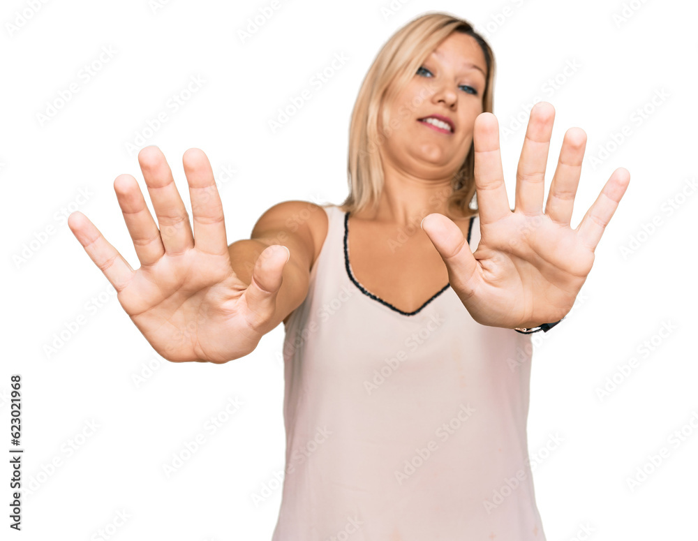 Middle age caucasian woman wearing casual clothes doing stop gesture with hands palms, angry and frustration expression Middle age caucasian woman wearing casual clothes doing stop gesture with hands palms, angry and frustration expression