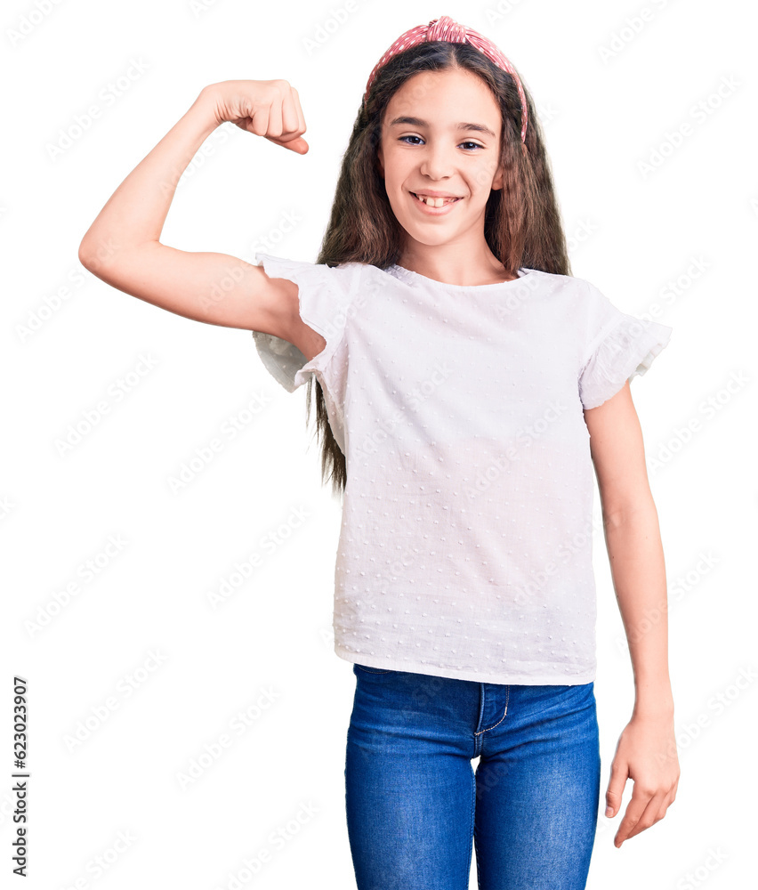 Cute hispanic child girl wearing casual white tshirt strong person showing arm muscle, confident and proud of power Cute hispanic child girl wearing casual white tshirt strong person showing arm muscle, confident and proud of power