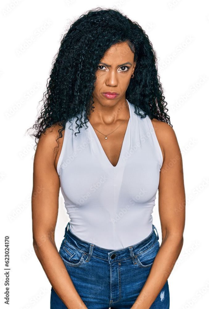 Middle age african american woman wearing casual style with sleeveless shirt skeptic and nervous, frowning upset because of problem. negative person.