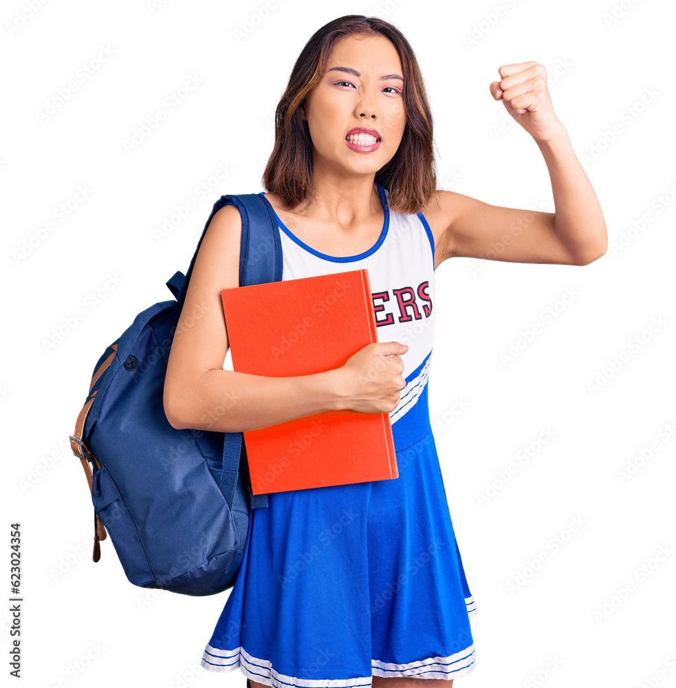 Young beautiful chinese girl wearing cheerleader uniform and student backpack holding binder annoyed and frustrated shouting with anger, yelling crazy with anger and hand raised Young beautiful chinese girl wearing cheerleader uniform and student backpack holding binder annoyed and frustrated shouting with anger, yelling crazy with anger and hand raised