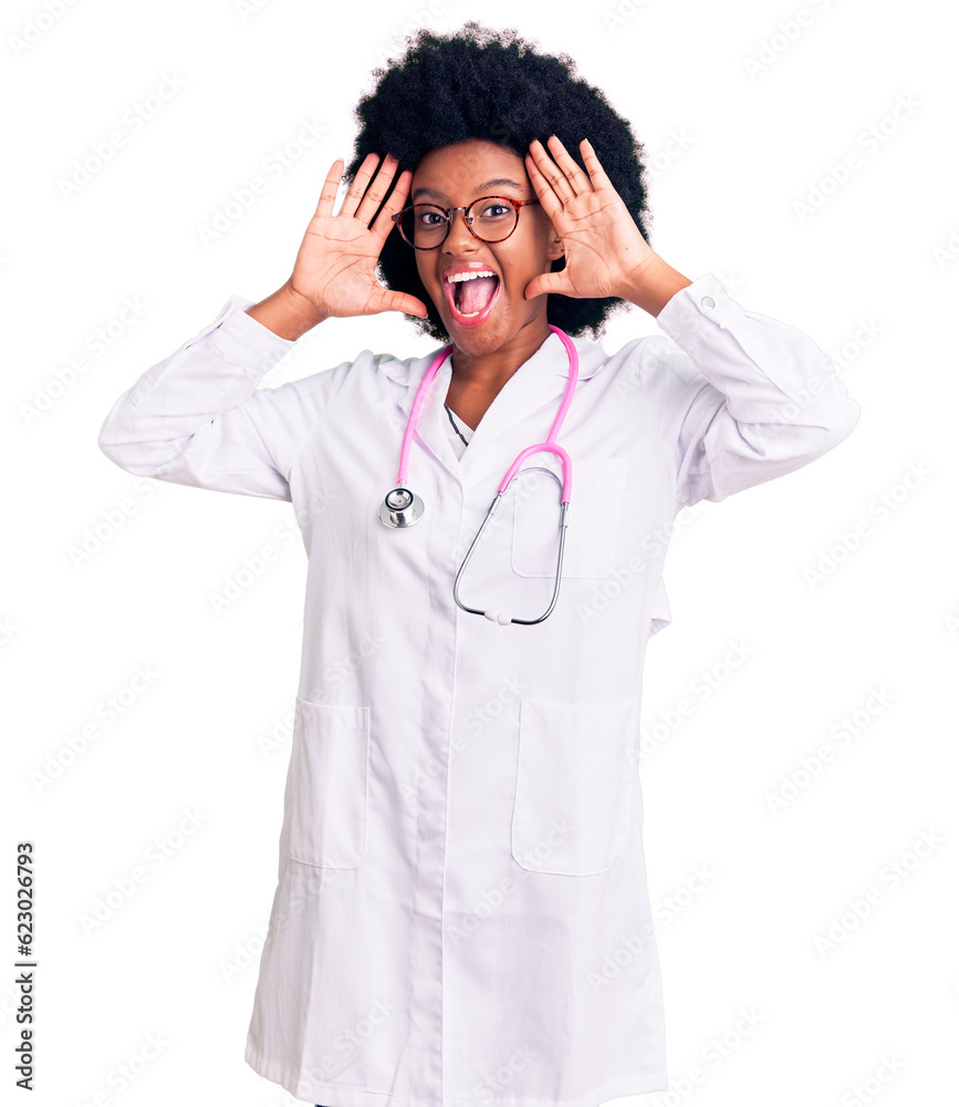 Young african american woman wearing doctor coat and stethoscope smiling cheerful playing peek a boo with hands showing face. surprised and exited Young african american woman wearing doctor coat and stethoscope smiling cheerful playing peek a boo with hands showing face. surprised and exited