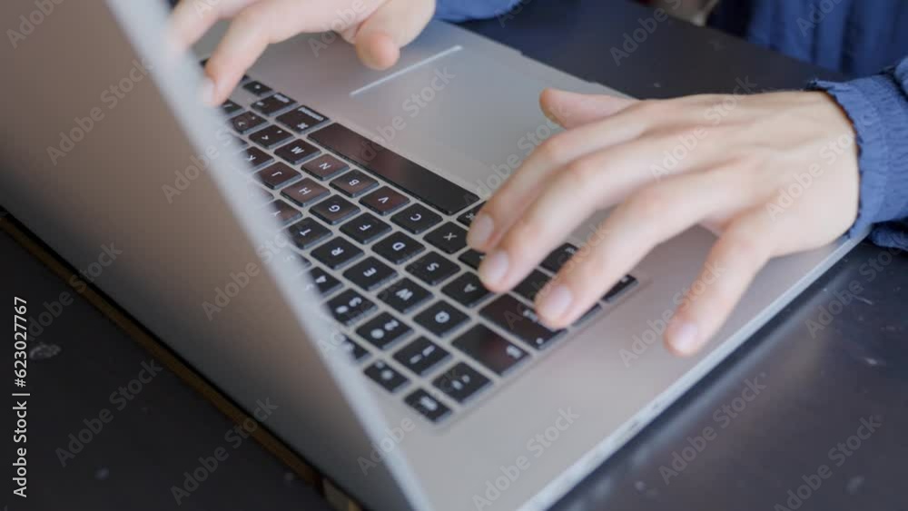 Woman hands typing keyboard of laptop computer, close up Woman hands typing keyboard of laptop computer, close up
