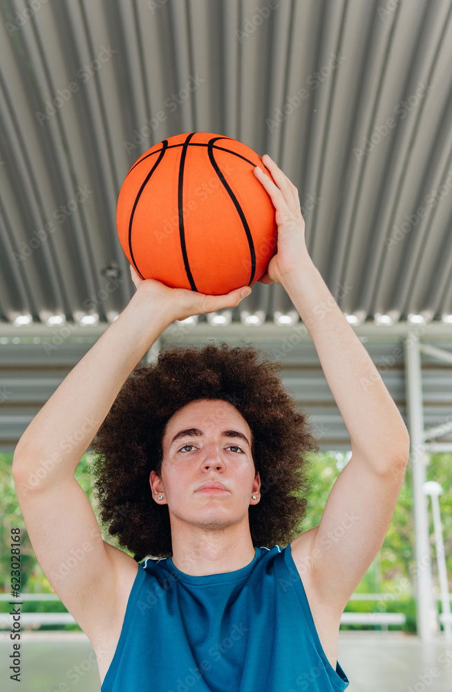 Teenage boy ready to throw a basketball