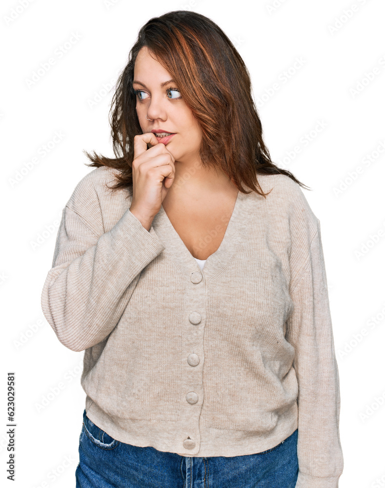 Young plus size woman wearing casual clothes looking stressed and nervous with hands on mouth biting nails. anxiety problem. Young plus size woman wearing casual clothes looking stressed and nervous with hands on mouth biting nails. anxiety problem.