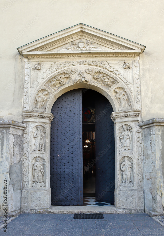 Rich decoration of entrance door of Church of Saint Lawrence in Zhovkva, Ukraine
