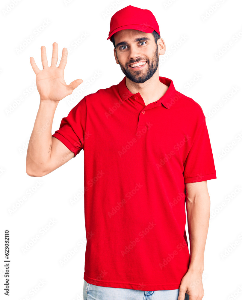 Young handsome man with beard wearing delivery uniform showing and pointing up with fingers number five while smiling confident and happy.