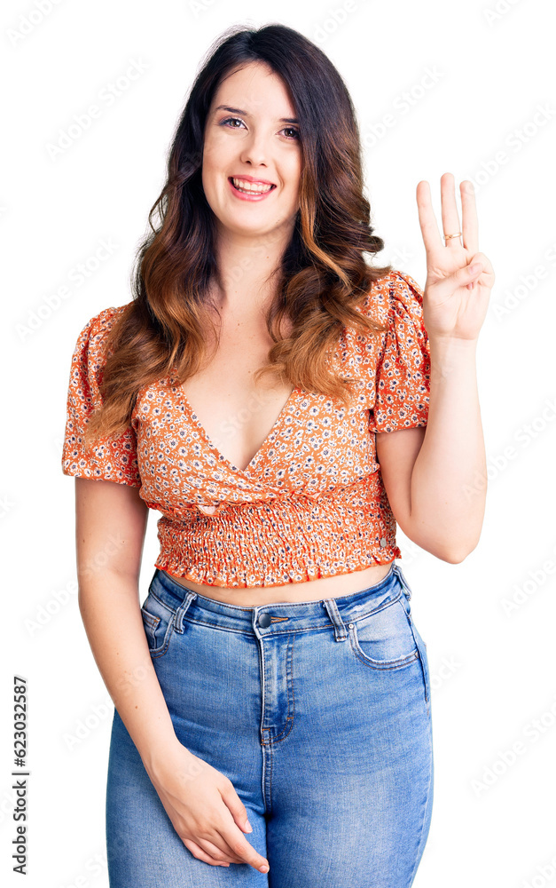 Beautiful young brunette woman wearing casual clothes showing and pointing up with fingers number three while smiling confident and happy. Beautiful young brunette woman wearing casual clothes showing and pointing up with fingers number three while smiling confident and happy.