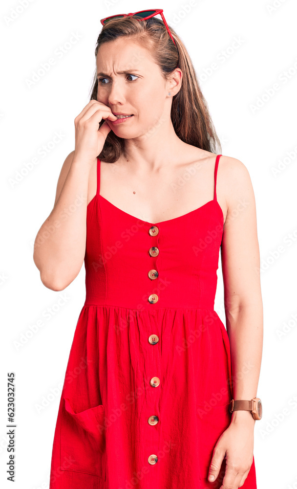 Young beautiful blonde woman wearing casual dress looking stressed and nervous with hands on mouth biting nails. anxiety problem. Young beautiful blonde woman wearing casual dress looking stressed and nervous with hands on mouth biting nails. anxiety problem.