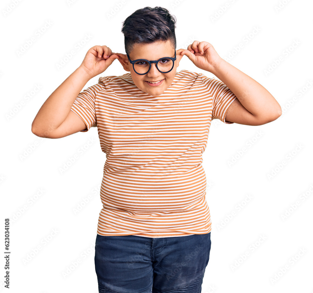 Little boy kid wearing casual clothes and glasses smiling pulling ears with fingers, funny gesture. audition problem Little boy kid wearing casual clothes and glasses smiling pulling ears with fingers, funny gesture. audition problem
