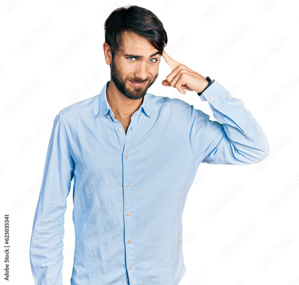 Hispanic man with blue eyes wearing business shirt smiling pointing to head with one finger, great idea or thought, good memory Hispanic man with blue eyes wearing business shirt smiling pointing to head with one finger, great idea or thought, good memory