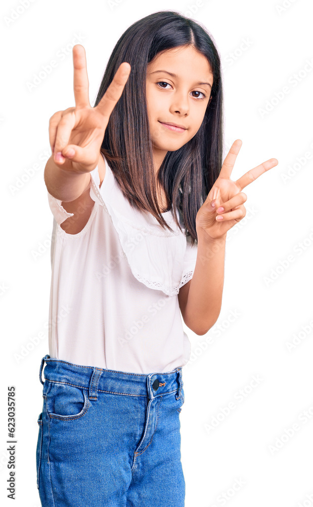 Beautiful child girl wearing casual clothes smiling looking to the camera showing fingers doing victory sign. number two. Beautiful child girl wearing casual clothes smiling looking to the camera showing fingers doing victory sign. number two.