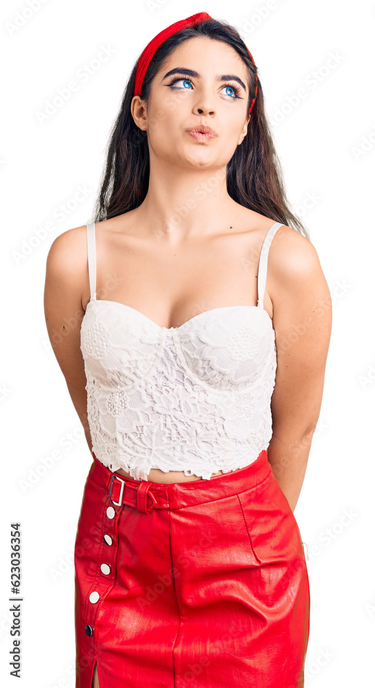 Brunette teenager girl wearing elegant look smiling looking to the side and staring away thinking. Brunette teenager girl wearing elegant look smiling looking to the side and staring away thinking.