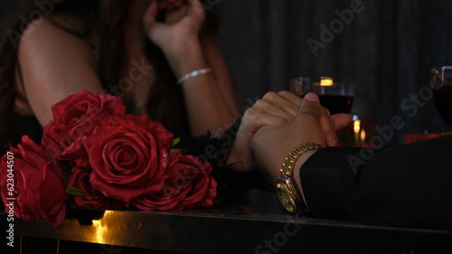 Two lovers on a date. Celebrating lovers. Valentine's day date. marriage proposal date. couple holding hands