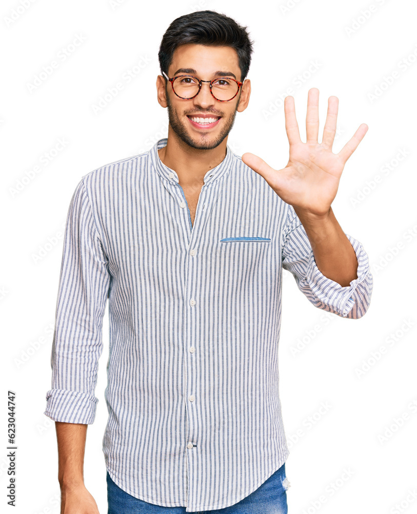 Young handsome man wearing casual clothes and glasses showing and pointing up with fingers number five while smiling confident and happy. Young handsome man wearing casual clothes and glasses showing and pointing up with fingers number five while smiling confident and happy.