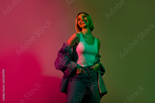 Photo of pretty lovely positive lady enjoying weekend pastime nightclub isolated on gradient colorful neon background