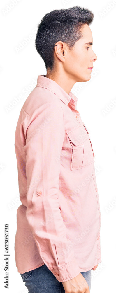 Young woman with short hair wearing casual clothes looking to side, relax profile pose with natural face and confident smile. Young woman with short hair wearing casual clothes looking to side, relax profile pose with natural face and confident smile.