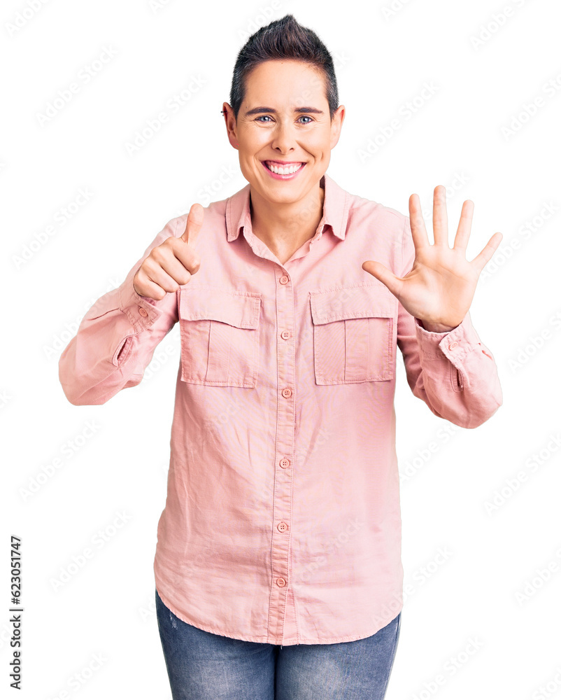 Young woman with short hair wearing casual clothes showing and pointing up with fingers number six while smiling confident and happy. Young woman with short hair wearing casual clothes showing and pointing up with fingers number six while smiling confident and happy.