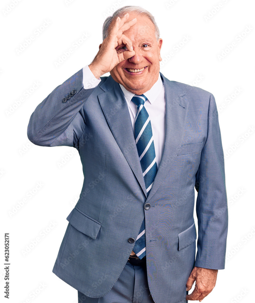 Senior handsome grey-haired man wearing elegant suit doing ok gesture with hand smiling, eye looking through fingers with happy face. Senior handsome grey-haired man wearing elegant suit doing ok gesture with hand smiling, eye looking through fingers with happy face.