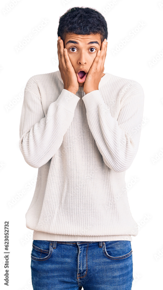 Young african amercian man wearing casual clothes afraid and shocked, surprise and amazed expression with hands on face